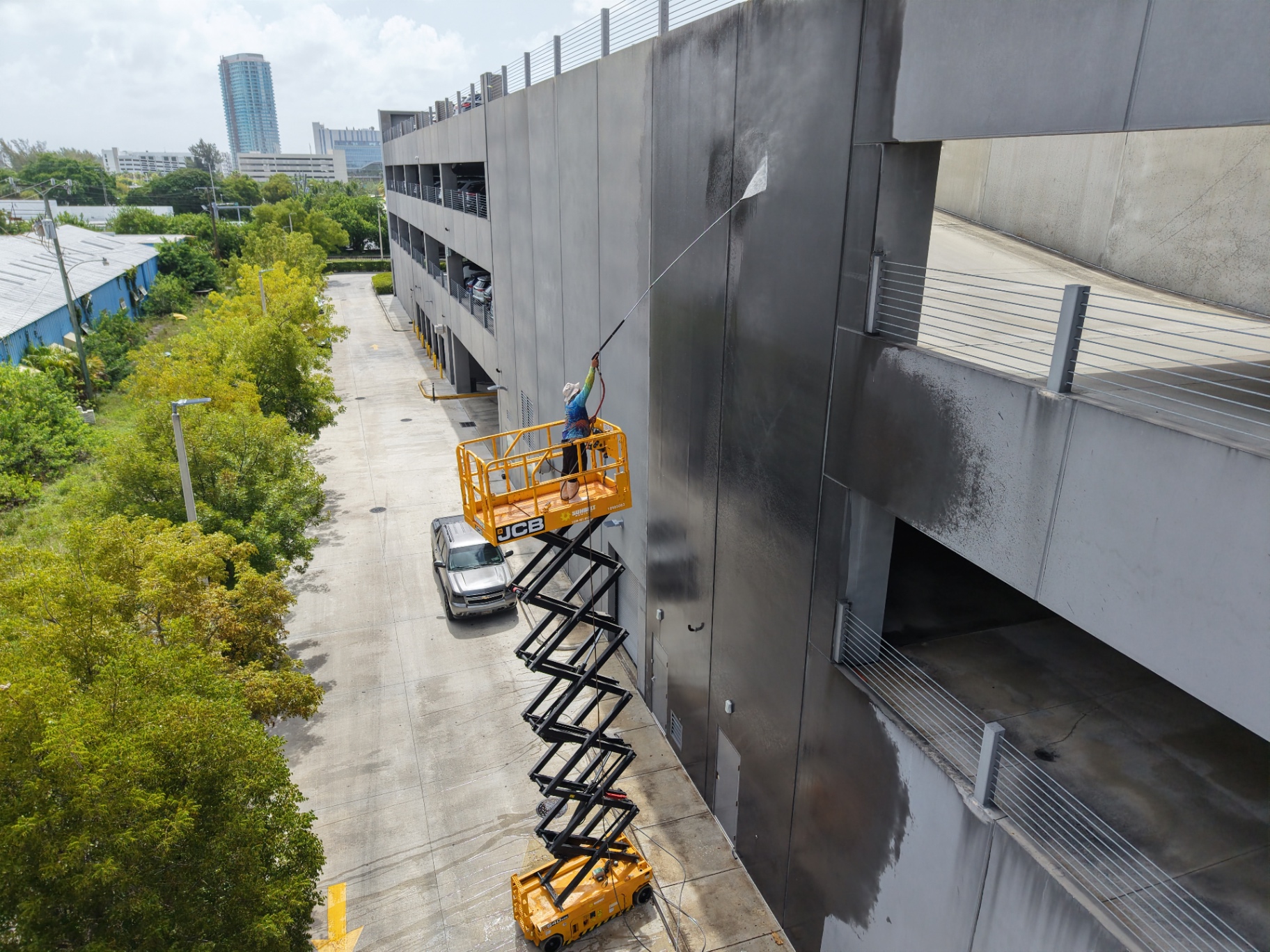 High pressure cleaning of parking garage concrete walls in Hialeah FL