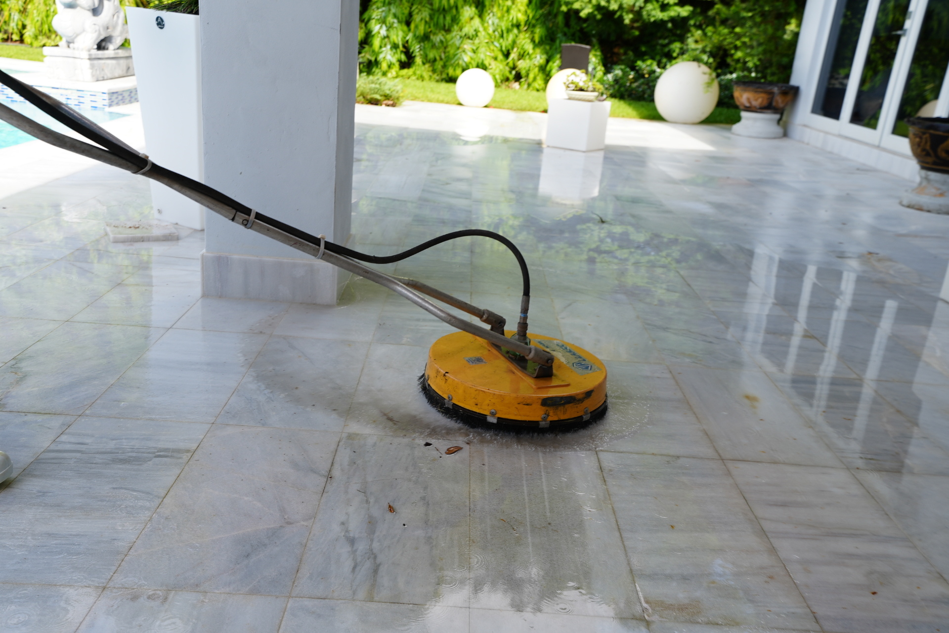 Dirty patio surface before pressure cleaning in Miami-Dade County
