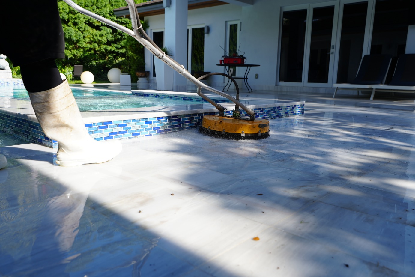 Surface cleaner detail on pool deck edge in Hialeah FL